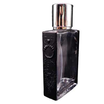 empty bottle of imported perfume recycled glass bottles black blue red pink green cap plastic and metal roll frog