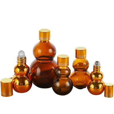 Chai lăn tinh dầu nước hoa thủy tinh hổ phách 10ml/50ml/100ml cao cấp, tùy chỉnh với lớp hoàn thiện gương vàng, nắp kép vàng & đế dày